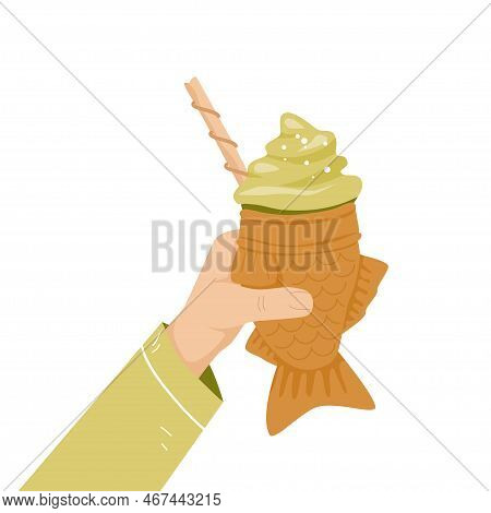 Human Hand Holding Bungeoppang Icecream. Korean Street Food Fish Shaped Pastry With Green Icecream F