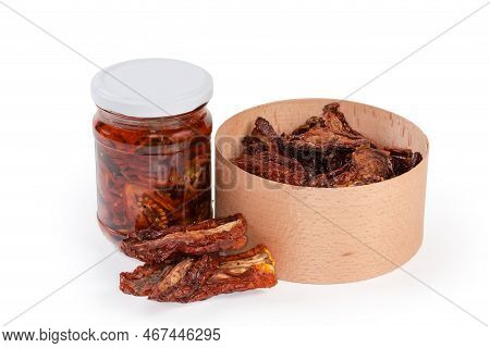 Dry-cured Red Tomatoes In The Round Wooden Box And Next To Her And Sun-dried Tomatoes Preserved In C
