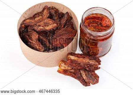 Dry-cured Red Tomatoes In The Round Wooden Box And Next To Her And Sun-dried Tomatoes Preserved In C