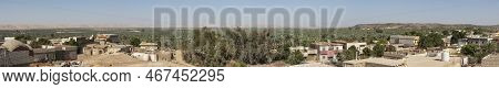 Panoramic View Over Remote African Egyptian Town With Oasis And Large Date Palm Farm Plantation