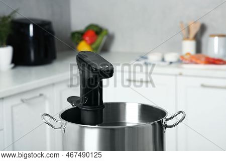 Pot With Sous Vide Cooker In Kitchen, Closeup. Thermal Immersion Circulator