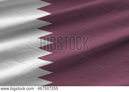 Qatar Flag With Big Folds Waving Close Up Under The Studio Light Indoors. The Official Symbols And C
