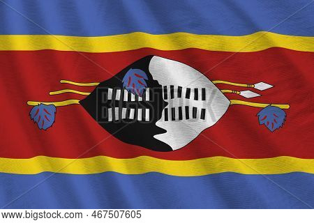Swaziland Flag With Big Folds Waving Close Up Under The Studio Light Indoors. The Official Symbols A
