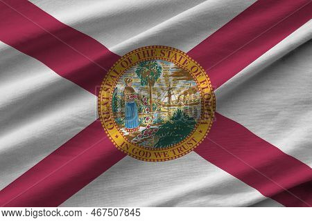 Florida Us State Flag With Big Folds Waving Close Up Under The Studio Light Indoors. The Official Sy