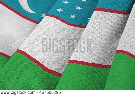 Uzbekistan Flag With Big Folds Waving Close Up Under The Studio Light Indoors. The Official Symbols 