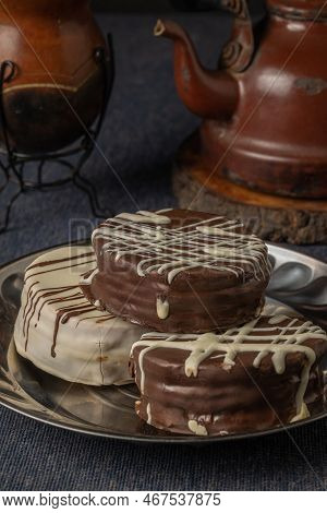 Alfajores, Typical Candy In Argentina, With Yerba Mate And A Kettle.