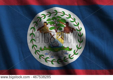 Belize Flag With Big Folds Waving Close Up Under The Studio Light Indoors. The Official Symbols And 