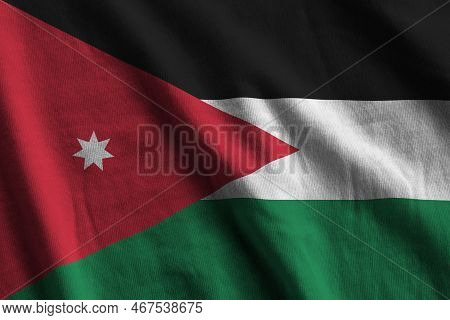 Jordan Flag With Big Folds Waving Close Up Under The Studio Light Indoors. The Official Symbols And 