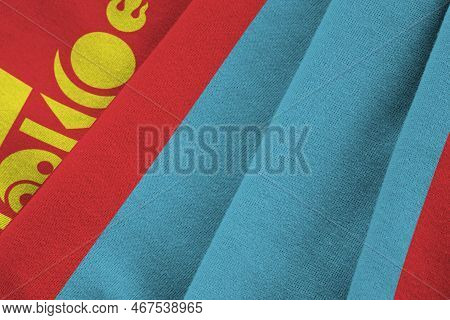 Mongolia Flag With Big Folds Waving Close Up Under The Studio Light Indoors. The Official Symbols An