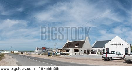 Lagulhas, South Africa - Sep 21, 2022: A Street Scene, With Restaurants And Vehicles, In Lagulhas In