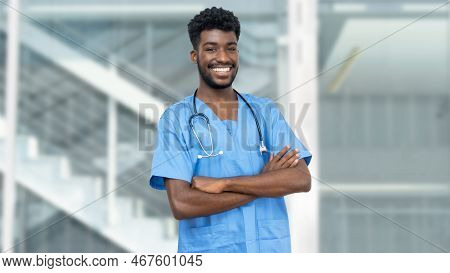 Laughing African American Male Nurse Or Medical Student With Beard At Hospital