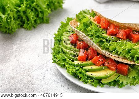 Sandwich With Salmon, Avocado, Lettuce, Sesame Seeds. Flatbread, Healthy Tortilla, Pita On Grey Back