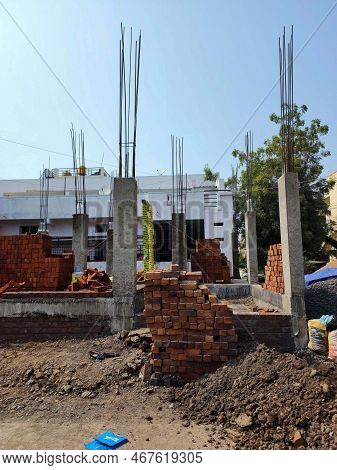 Gulbarga, India- November 27th 2022; Stock Photo Of House Under Construction, Red Bricks, Soil, Wate