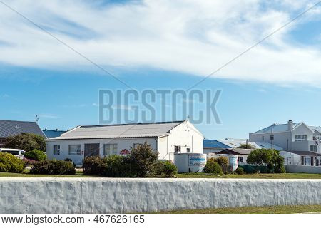 Struisbaai, South Africa - Sep 21, 2022: Street Scene, With A Community Service Building And Safe Ho