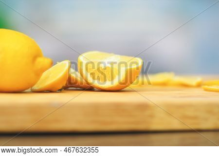 Close Up.cook The Orange Slices On A Wooden Board