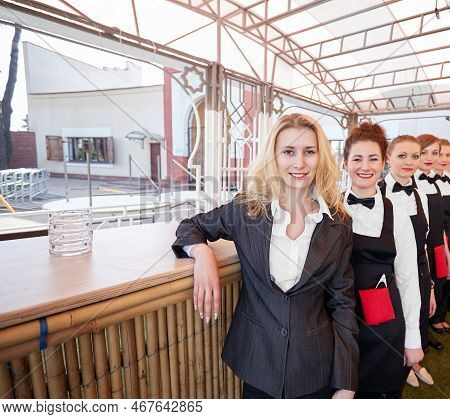 Hotel Staff Standing In The Corridor Of A Modern Hotel
