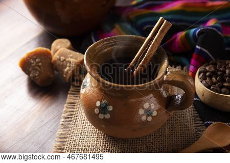 Authentic Homemade Mexican Coffee (cafe De Olla) Served In Traditional Handmade Clay Mug (jarrito De