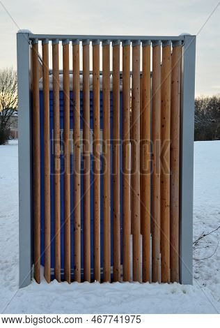 Closing Cage For Placing Chemical Toilets. Unsightly Plastic Boxes Are Inside A Metal House With A F