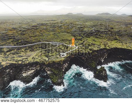 Aerial View Of Orange Svortuloft Lighthouse By The Sea In West Iceland Highlands, Snaefellsnes Penin