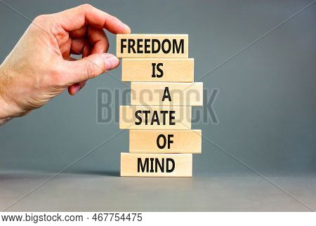 Freedom In Mind Symbol. Concept Words Freedom Is A State Of Mind On Wooden Blocks On A Beautiful Gre