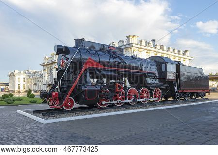 Rybinsk, Russia - September 10, 2020: Old Soviet Steam Locomotive Of L Series (lebedyanka) Against T