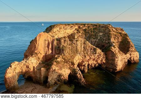 Secluded Limestone Island And Beach Praia João De Arens In Algarve Region, Portugal