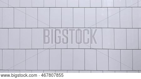 Fragment Of A Wall Faced With Light Tiles