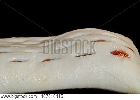 One Uncooked Puff Pastry Bun With Red Strawberry Jam On Tray In Electric Oven - Close Up Macro Side 