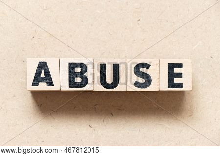Alphabet Letter Block In Word Abuse On Wood Background