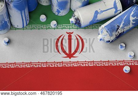 Iran Flag And Few Used Aerosol Spray Cans For Graffiti Painting. Street Art Culture Concept, Vandali