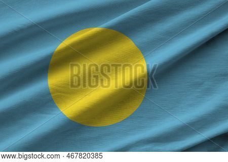 Palau Flag With Big Folds Waving Close Up Under The Studio Light Indoors. The Official Symbols And C