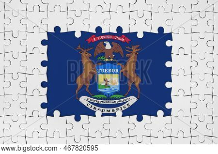 Michigan Us State Flag In Frame Of White Puzzle Pieces With Missing Central Parts