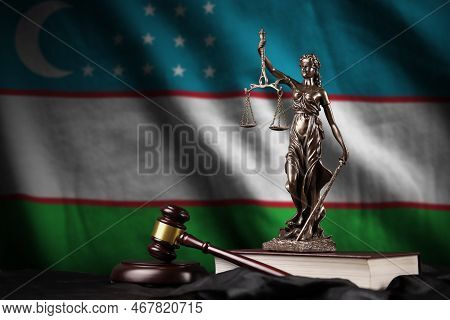 Uzbekistan Flag With Statue Of Lady Justice, Constitution And Judge Hammer On Black Drapery. Concept