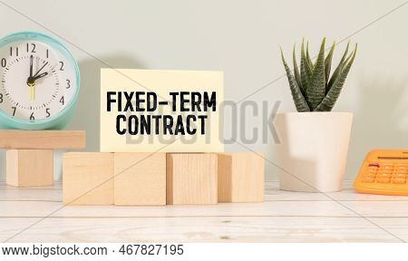 Top View Clock And Miniature People With Text Fixed-term Contract On A White Puzzle Background.
