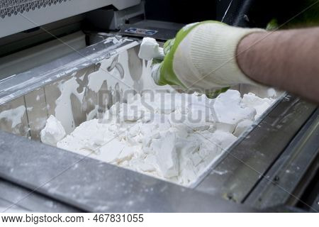 Mane Taking Out Models From White Polyamide Powder In Working Chamber Of 3d Printer, Cleaning And Re