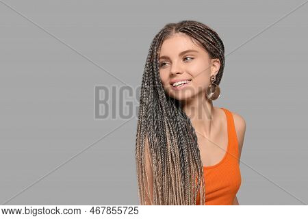 Beautiful Woman With Long African Braids On Grey Background, Space For Text