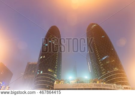 Dubai, United Arab Emirates - December 23, 2017: Damac Park Towers Architectural Structures At Night