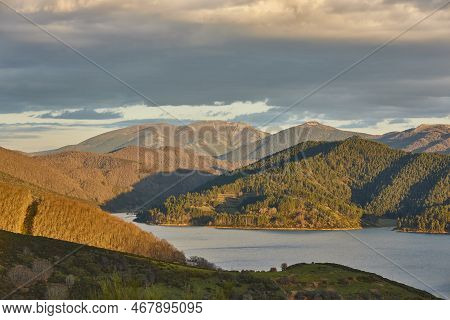 Mountain Landscape And Forest In Winter At Sunset. Castilla Leon. Spain