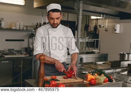 Chef Preparing Salad In The Modern Kitchen Of Restaurant. Tasty And Healthy Food