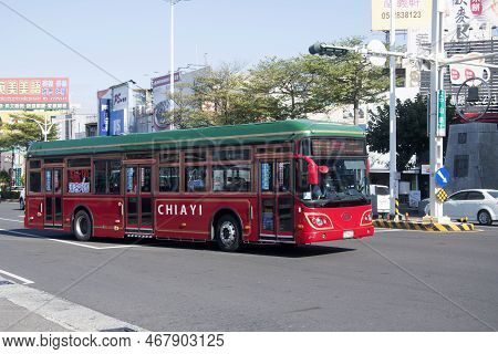 Chiayi, Taiwan- 5 Dec, 2022: Public Bus Travels On The Street Of Chiayi City. Chiayi Is A Major City