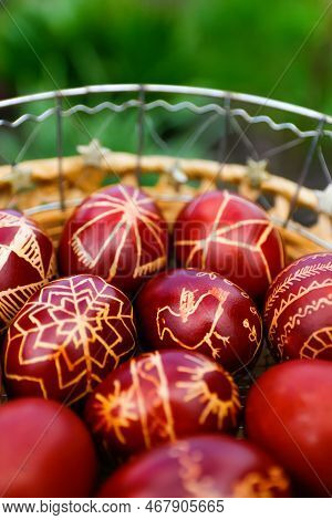 Defocus Closeup Of Basket Of Colored Red Eggs, Easter Holiday Concept. Modern Painted Easter Eggs. C
