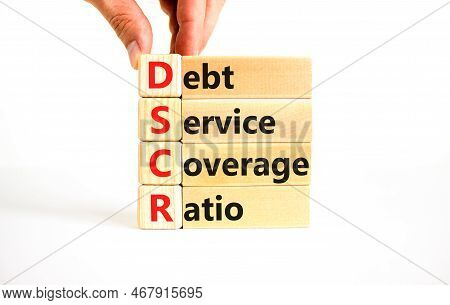 Dscr Debt Service Coverage Ratio Symbol. Concept Words Dscr Debt Service Coverage Ratio On Wooden Bl