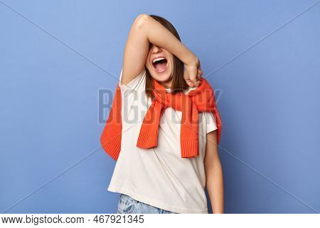 Portrait Of Shy Young Adult Woman Wearing Casual Style Clothing, Covering Her Mouth With Hand, Screa