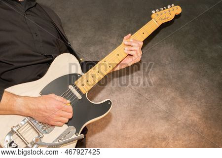 Vaduz, Liechtenstein, December 23, 2022 Musician Plays With A White Fender Telecaster Electric Guita