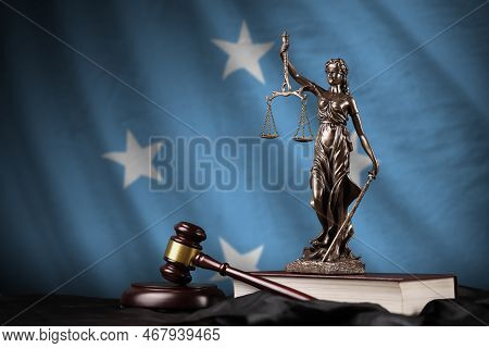 Micronesia Flag With Statue Of Lady Justice, Constitution And Judge Hammer On Black Drapery. Concept