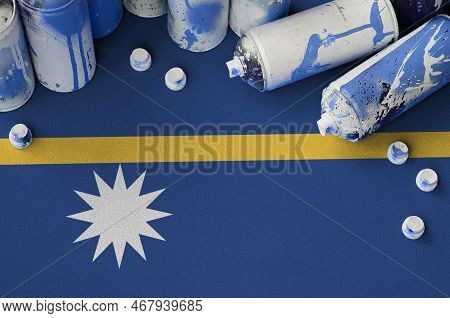 Nauru Flag And Few Used Aerosol Spray Cans For Graffiti Painting. Street Art Culture Concept, Vandal