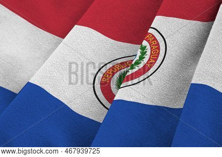 Paraguay Flag With Big Folds Waving Close Up Under The Studio Light Indoors. The Official Symbols An
