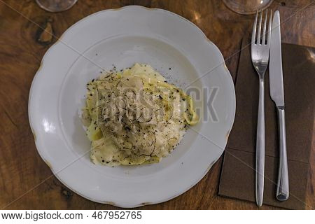 Fresh Pasta With Truffle In Pecorino Cheese Wheel In Restaurant, Florence, Italy