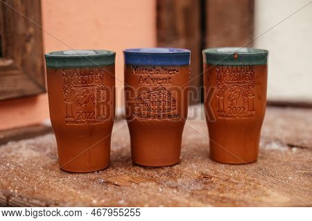 Dresden, Saxony, Germany, 10 December 2022: Clay Cups And Barrels For Christmas Mulled Wine On Woode