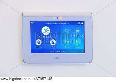 Calgary, Alberta, Canada. Dec 25, 2022. An Adt Home Security Touchscreen Panel. A Command Center For